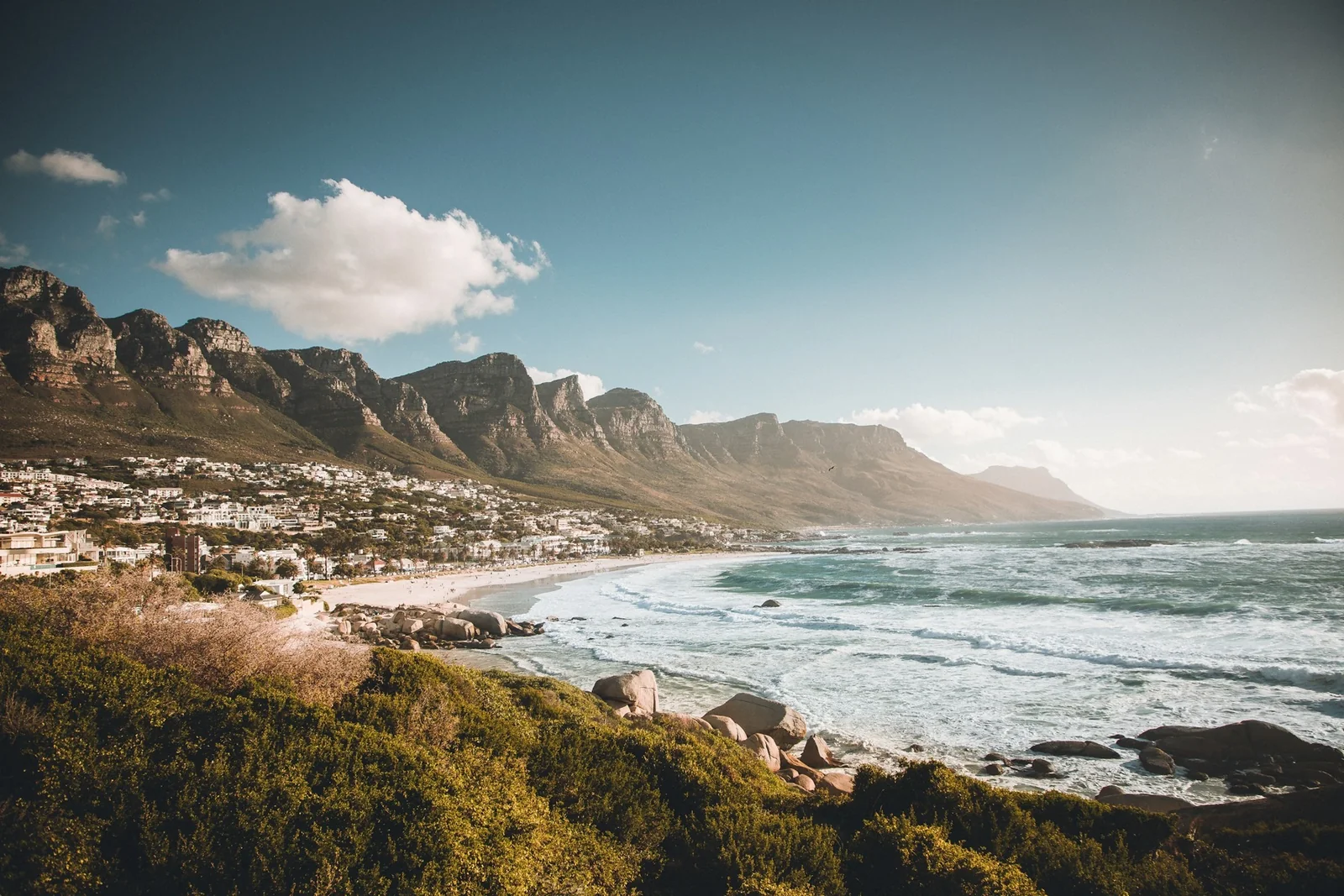 The Atlantic coast at Camps Bay beneath the Twelve Apostles mountains.